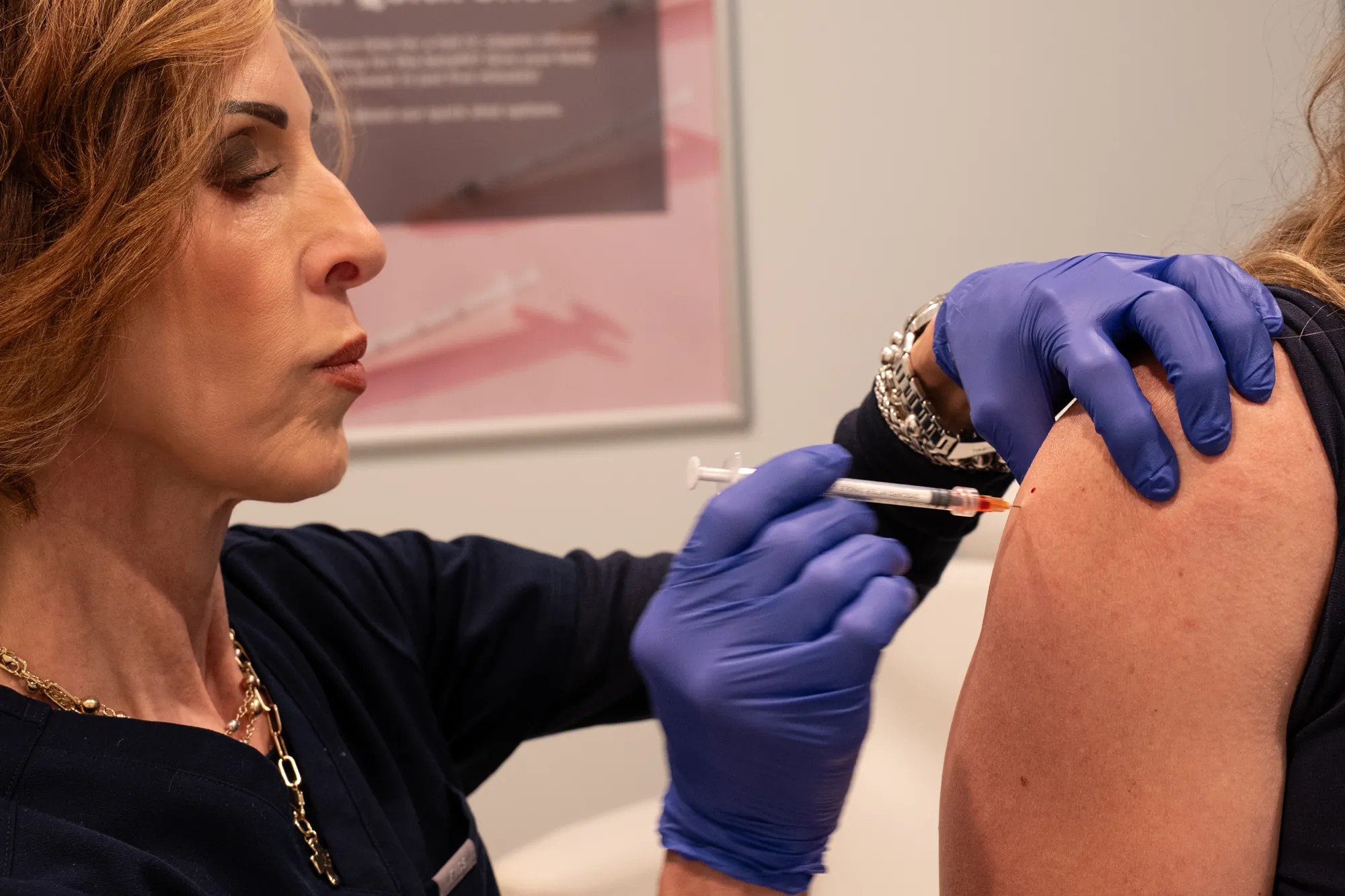 Licensed Minnesota Registered Nurse preparing a vitamin shot